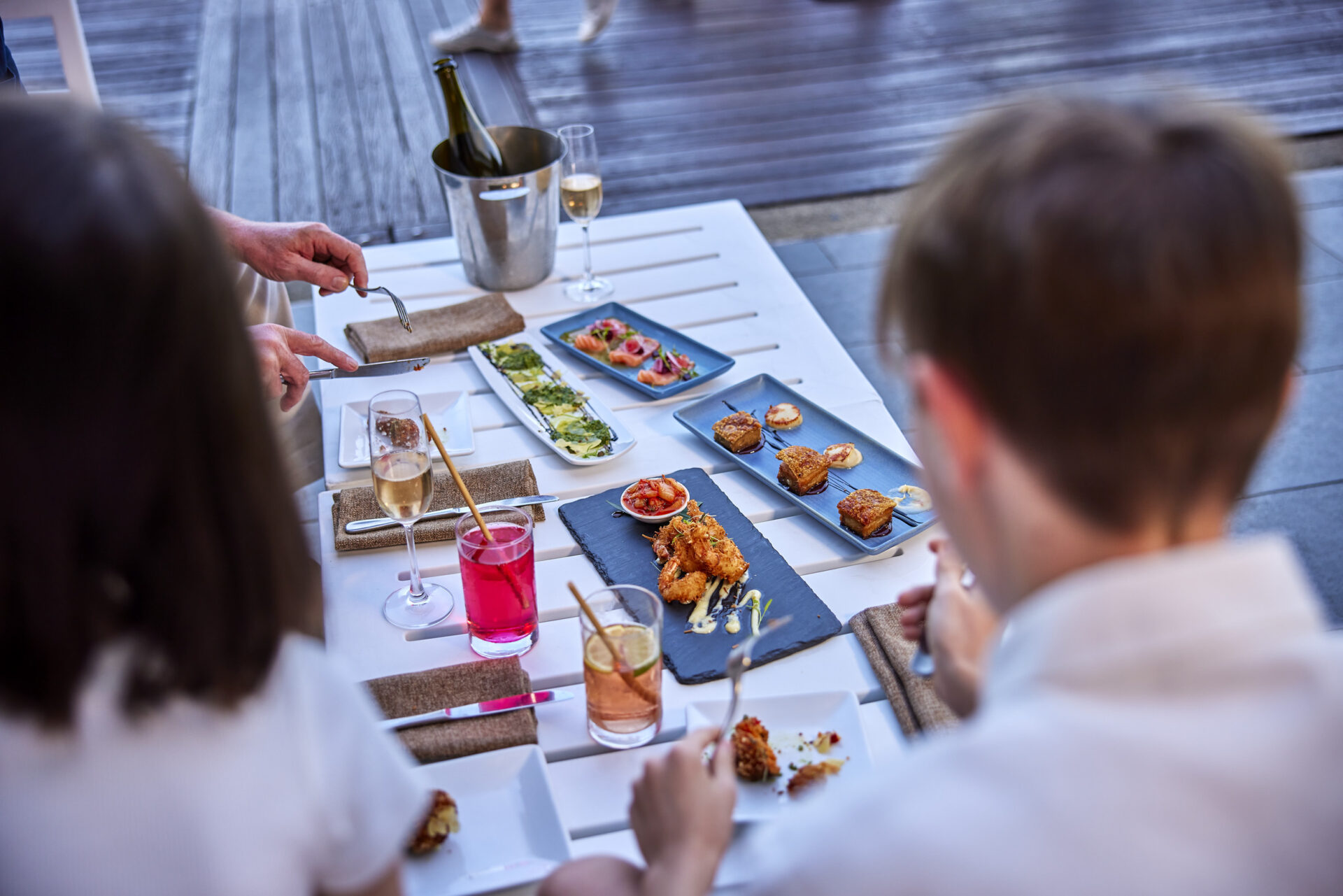Family dining on shared plates at Ochre Restaurant