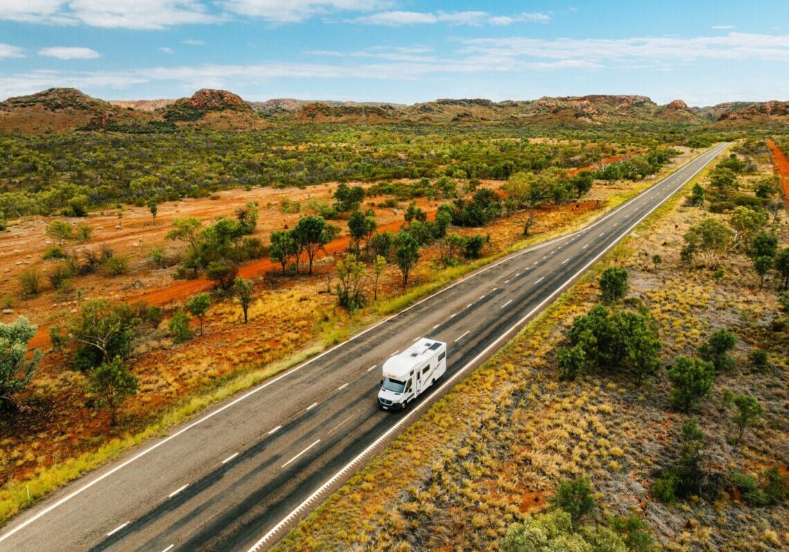 Driving through vast landscape near Mount Isa