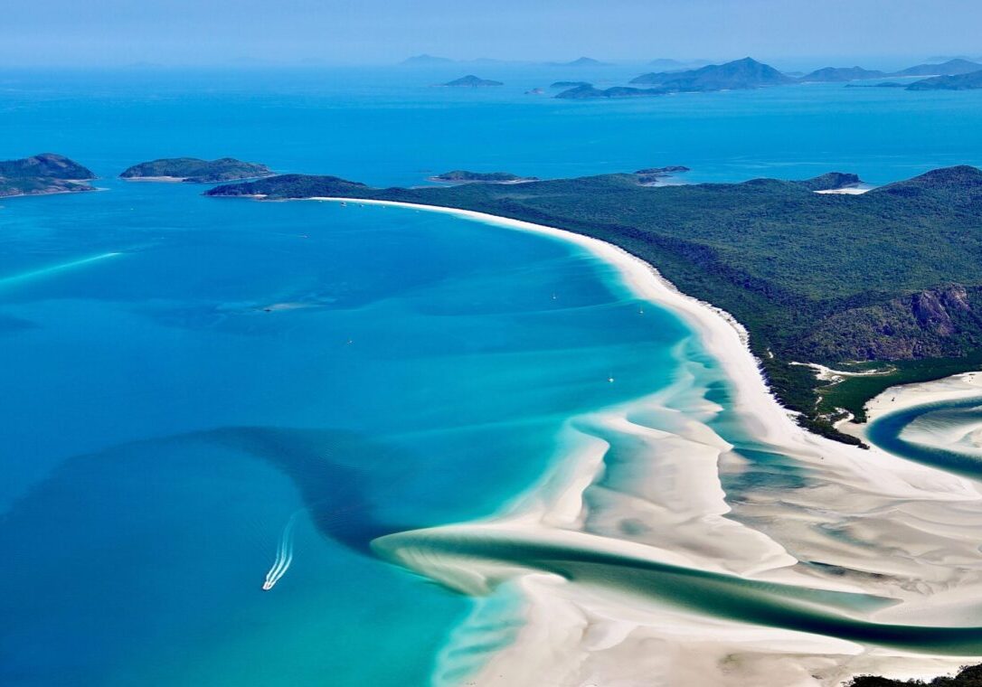 Scenic flight with Ocean Rafting over the islands and Great Barrier Reef, including famous Heart Reef and Whitehaven Beach